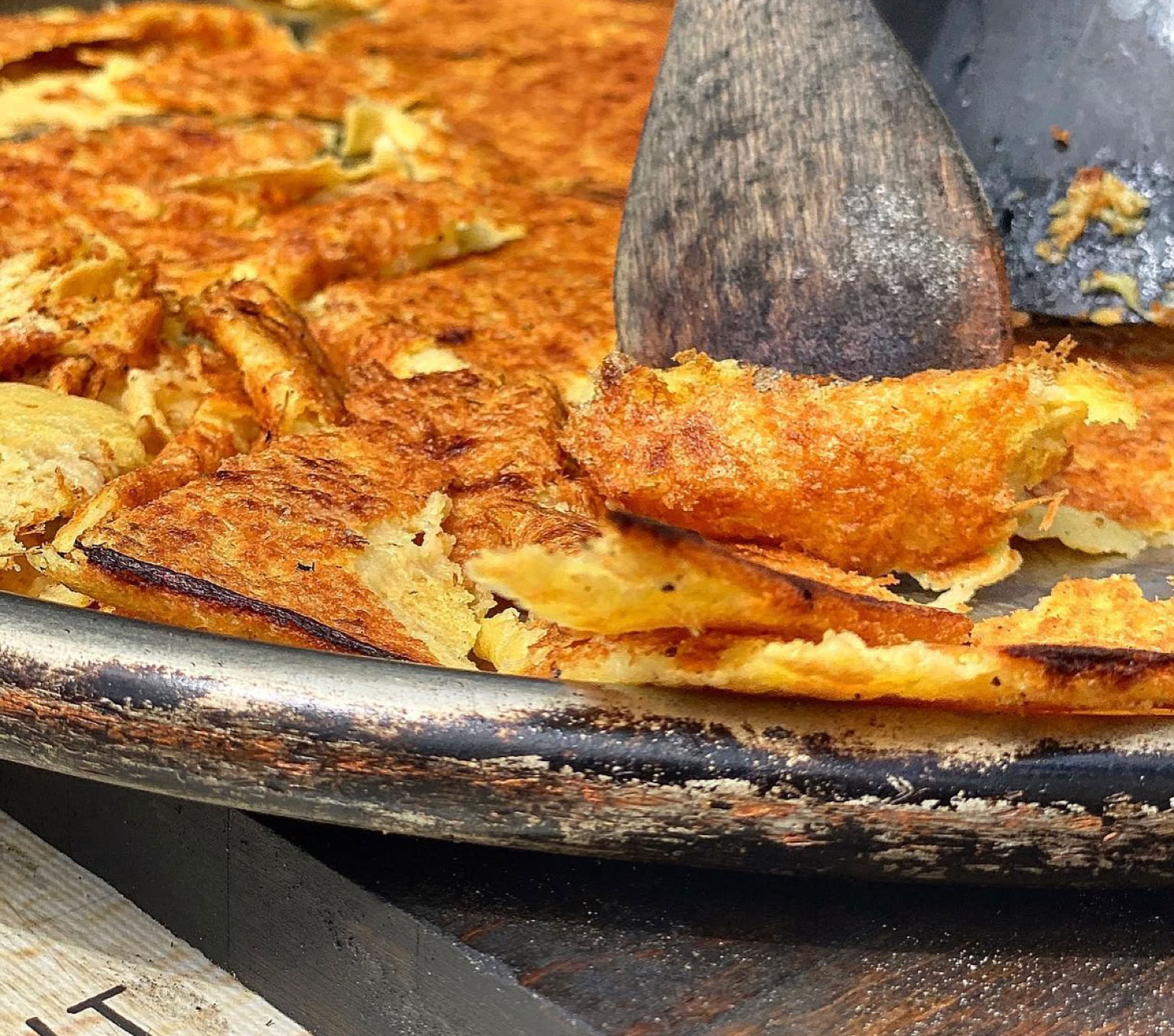 Another Niçoise Treasure! This is a very popular culinary specialty in Nice, but also enjoyed in other parts of the French Riviera. Socca is a type of thin pancake or flatbread made from chickpea flour, water, olive oil, and salt. It's baked in a very hot oven until the edges become crispy while the center remains soft and tender.
