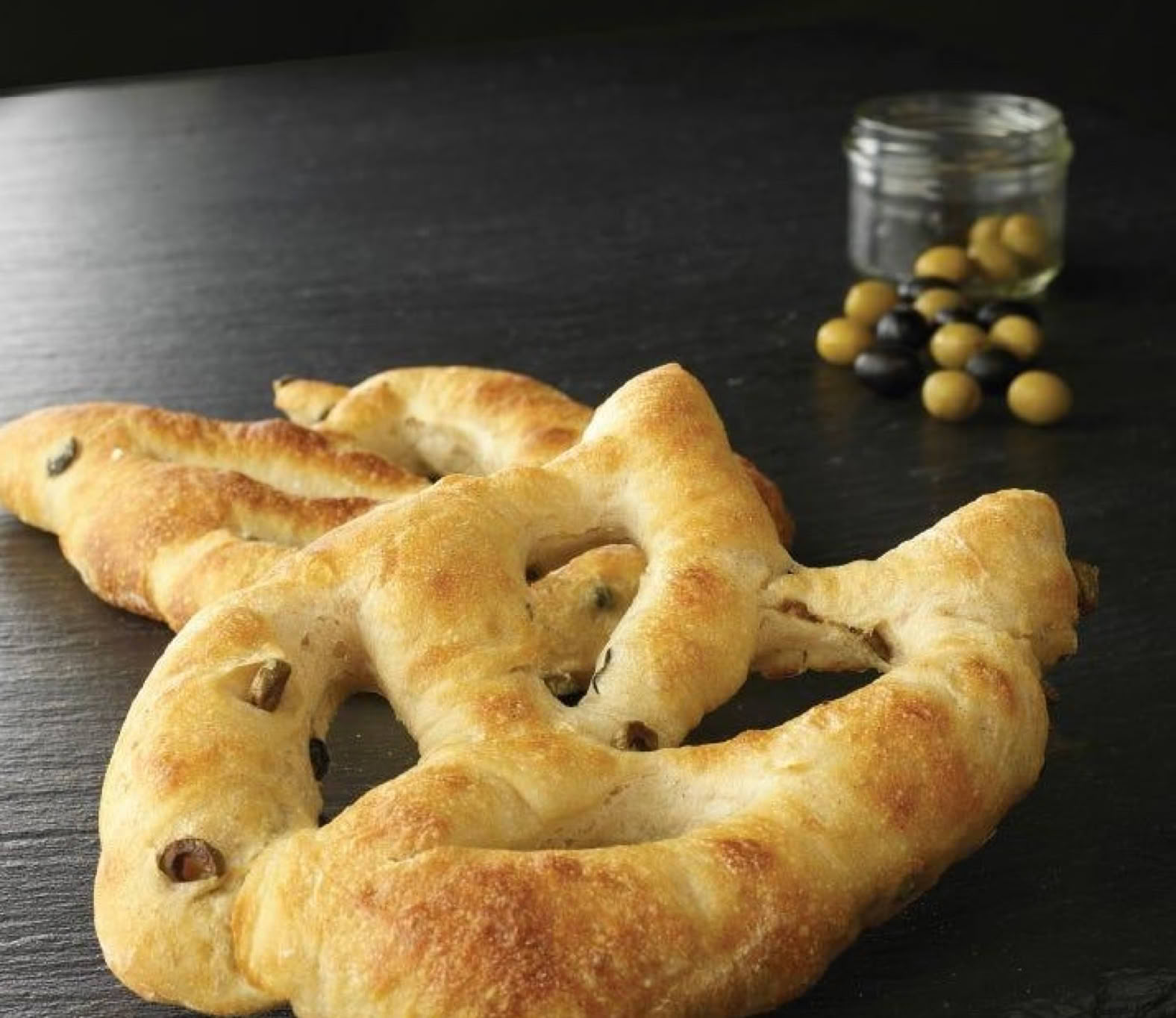 Fougasse is a traditional Provençal bread easily recognizable by its elongated, open-cut shape, reminiscent of a wheat stalk or a leaf.